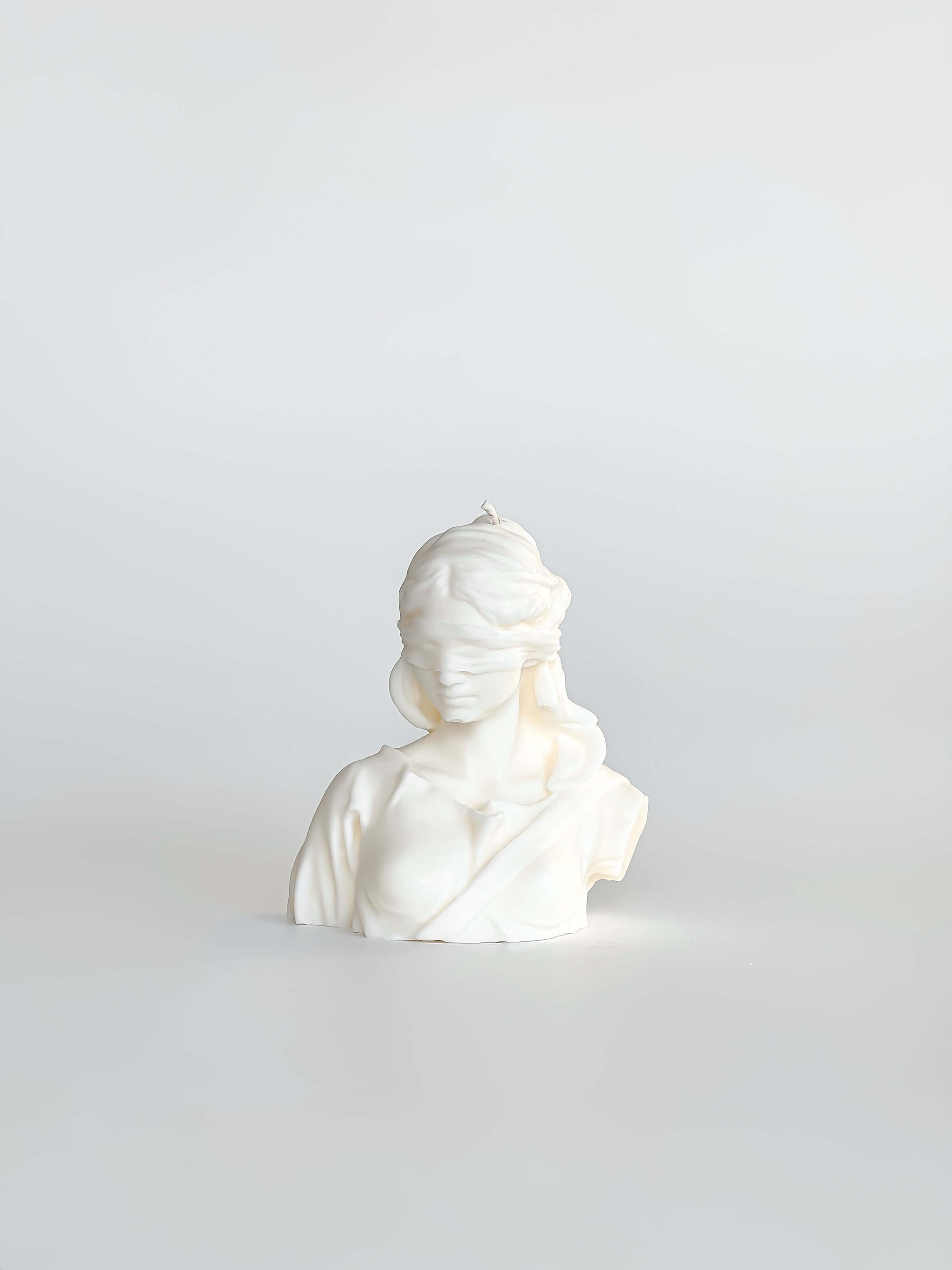 Experience the soothing ambiance of our Decorative Justice Candle, a symbol of harmony and balance. Perfect for gifting or adding a touch of elegance to your home decor