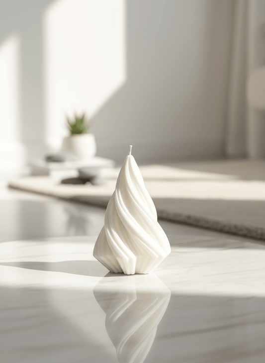 White candle on a marble surface with a blurred background